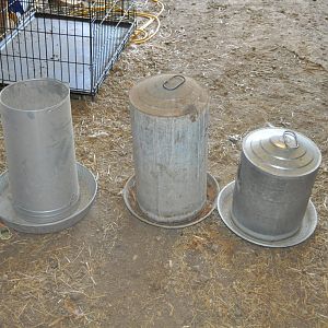 Two on left are water's.  One on right is feeder.  I do have at least one heated base for winter time use with the water's.  I may also have a second one, but would have to dig for it.