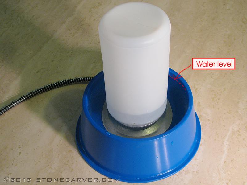 Heated store water dish