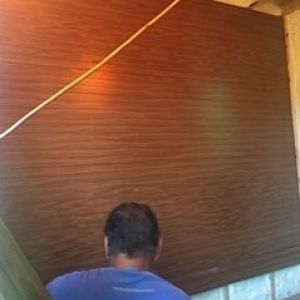 Putting the inside wall on with upcyled wood.