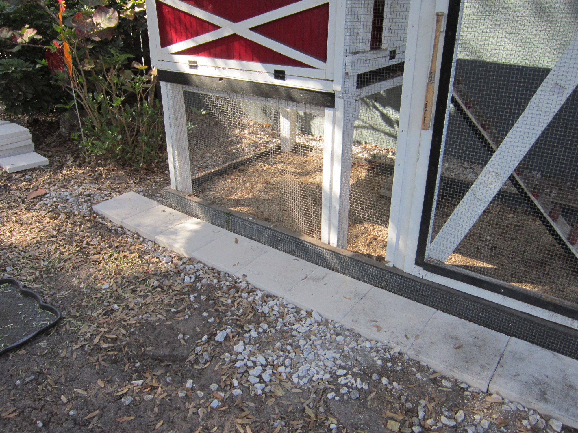Replaced marble chips which wound up EVERYWHERE with concrete tiles. Let's see you
move those...oh God, I hope not!